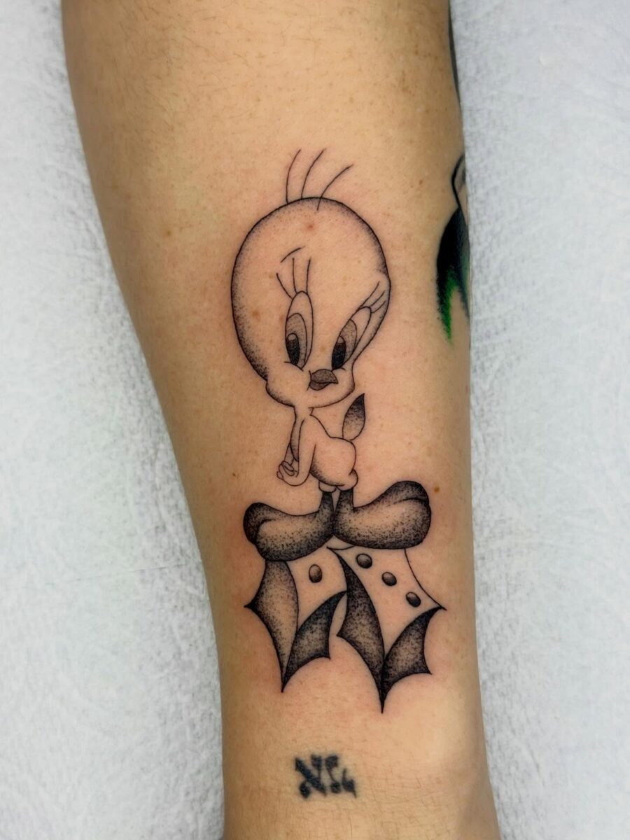 Charming Tweety Tattoo with Holiday Vibes