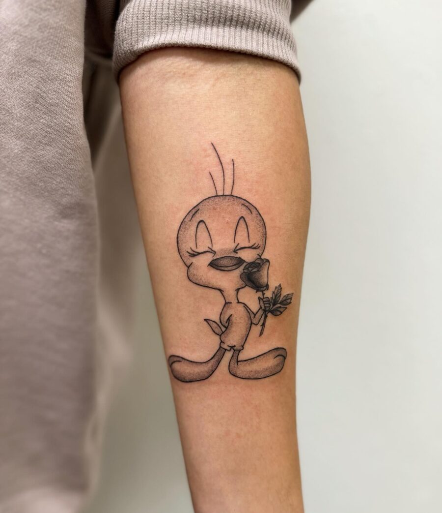 Adorable Tweety Bird Tattoo with a Rose