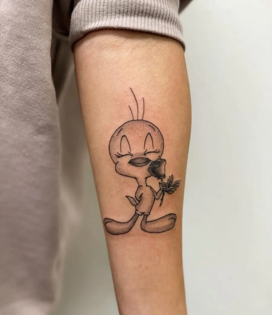 Adorable Tweety Bird Tattoo with a Rose