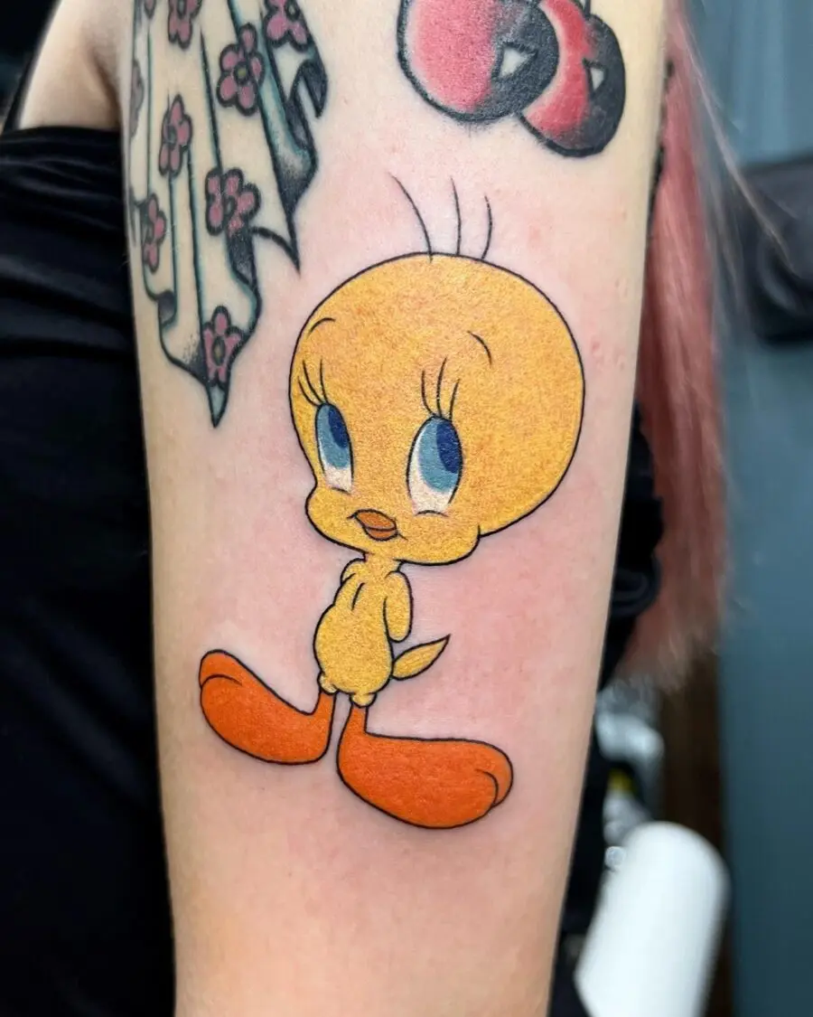 Bright and cheerful Tweety tattoo on display