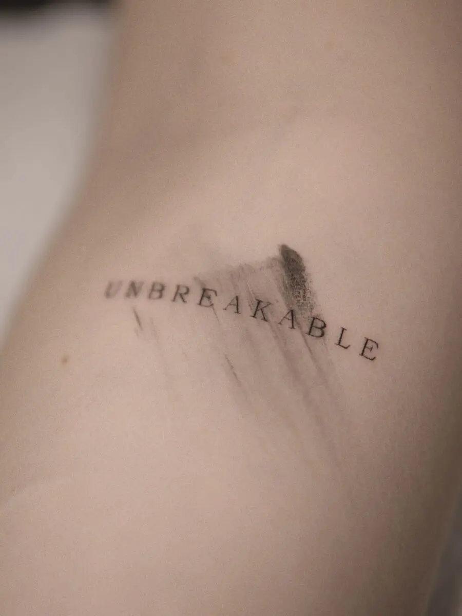 Minimalist tattoo with a powerful message.