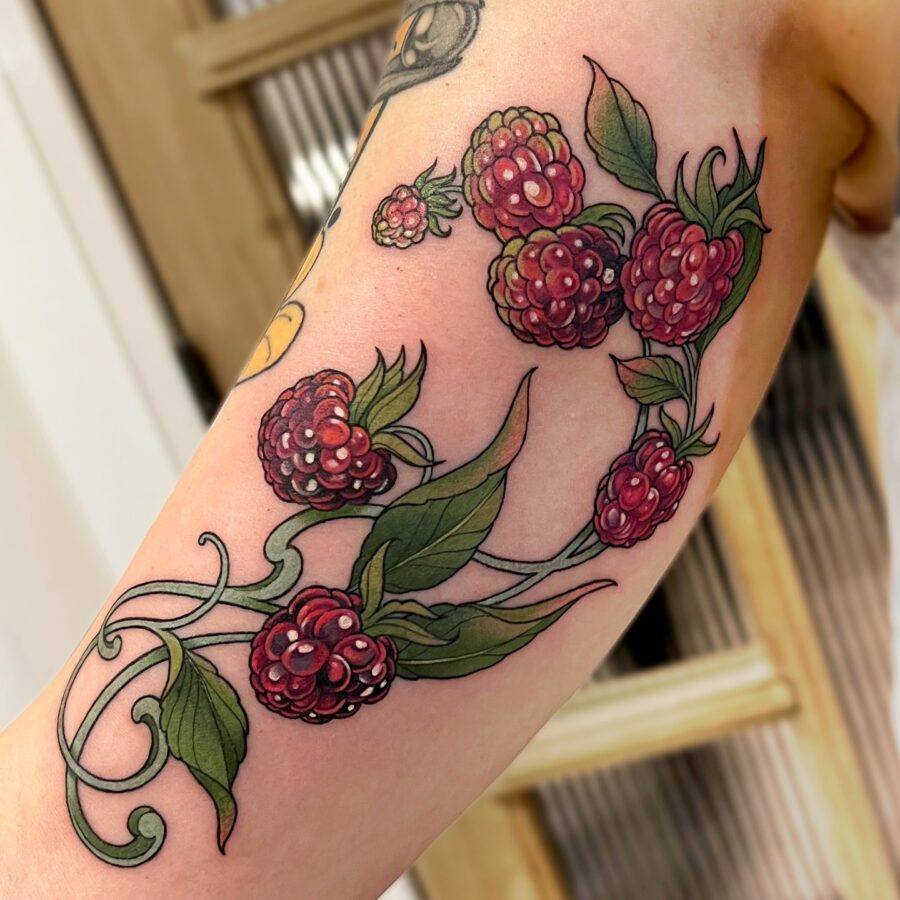 A vibrant berry tattoo for arm expression