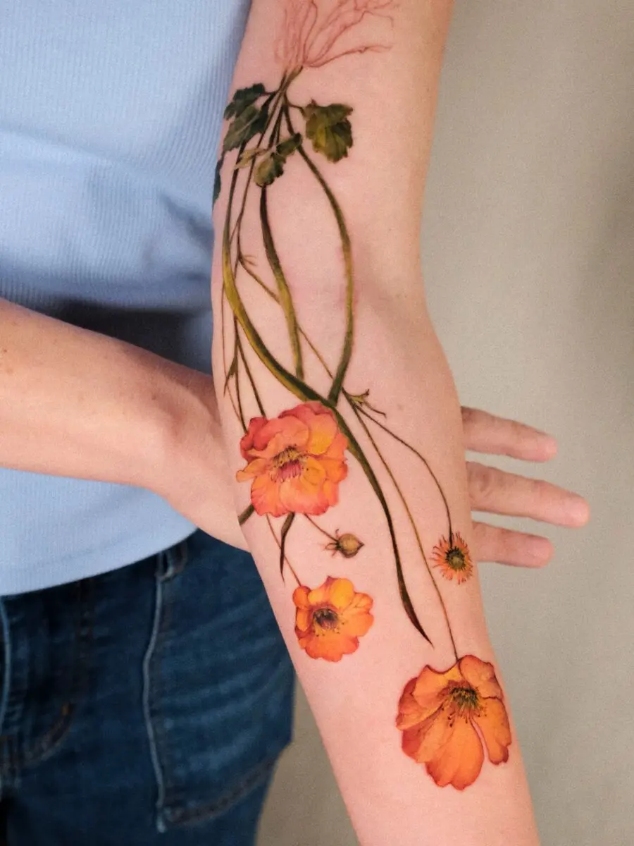 Elegant florals woven into vibrant tattoo artistry