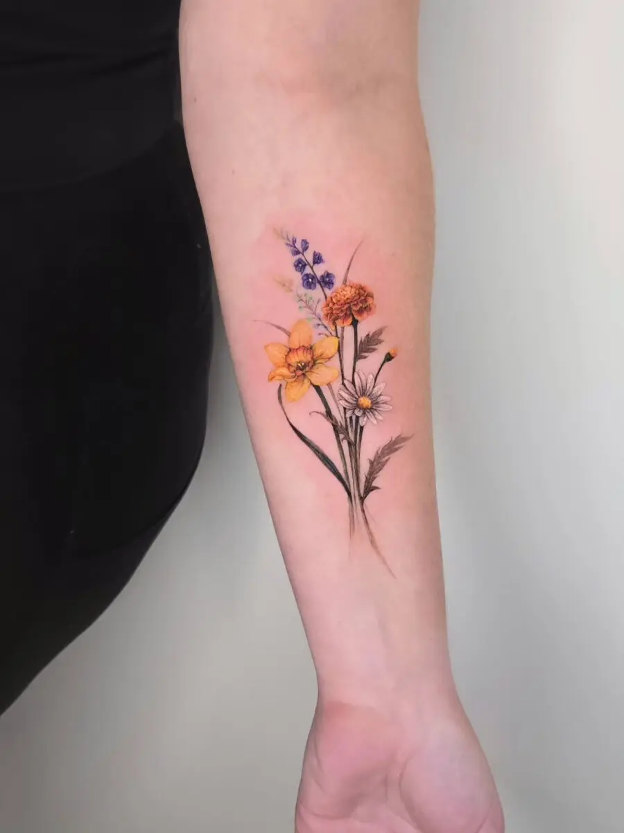 Stunning floral tattoo celebrating birth flowers