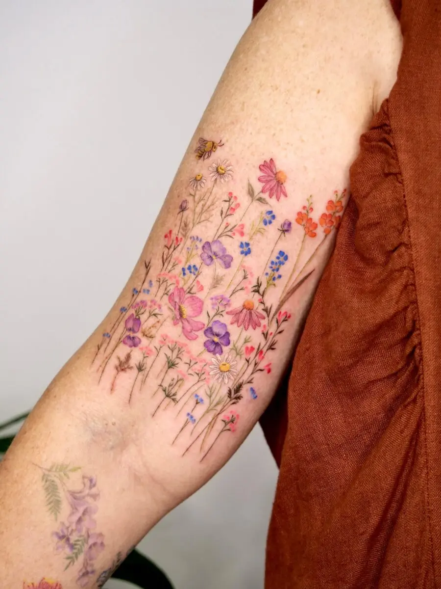 Colorful floral arm tattoo illustration