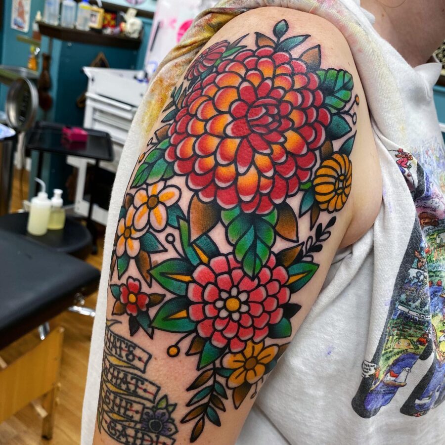 Bold and colorful dahlia tattoo design inspiration