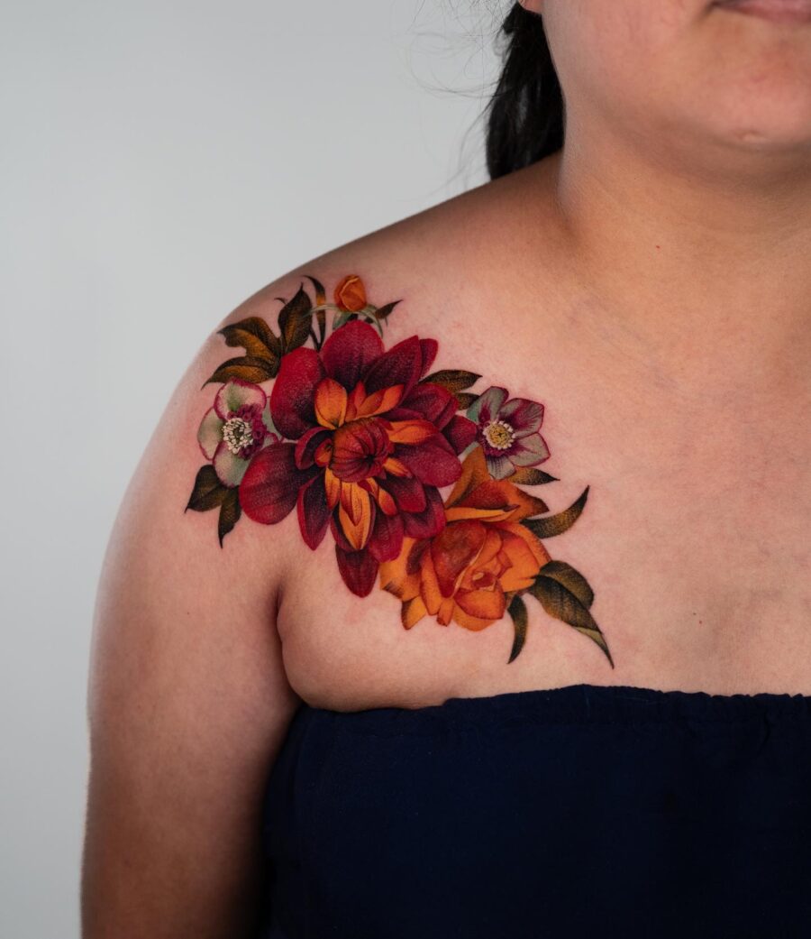 Vibrant dahlia tattoo adorned on the shoulder
