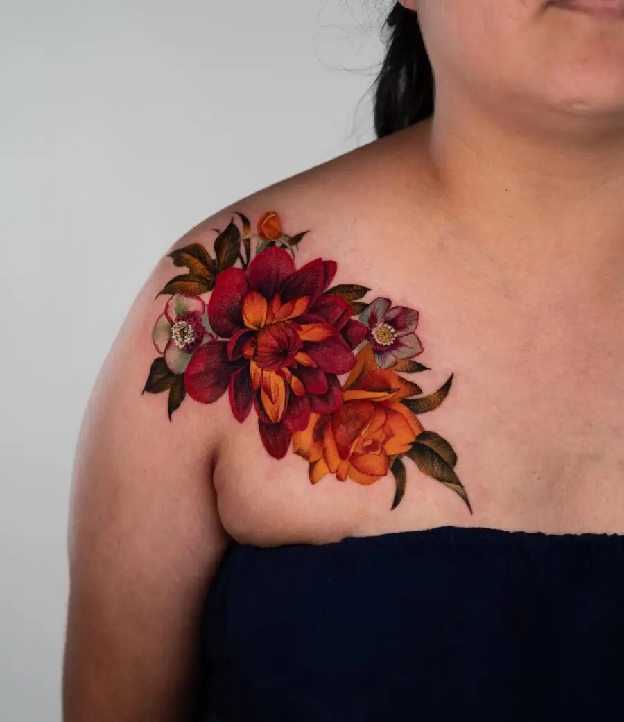 Vibrant dahlia tattoo adorned on the shoulder