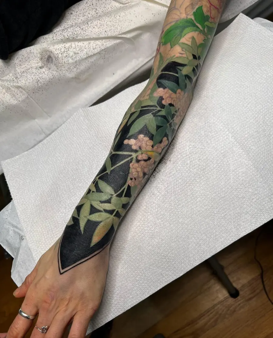 Stunning floral cover-up tattoo on forearm
