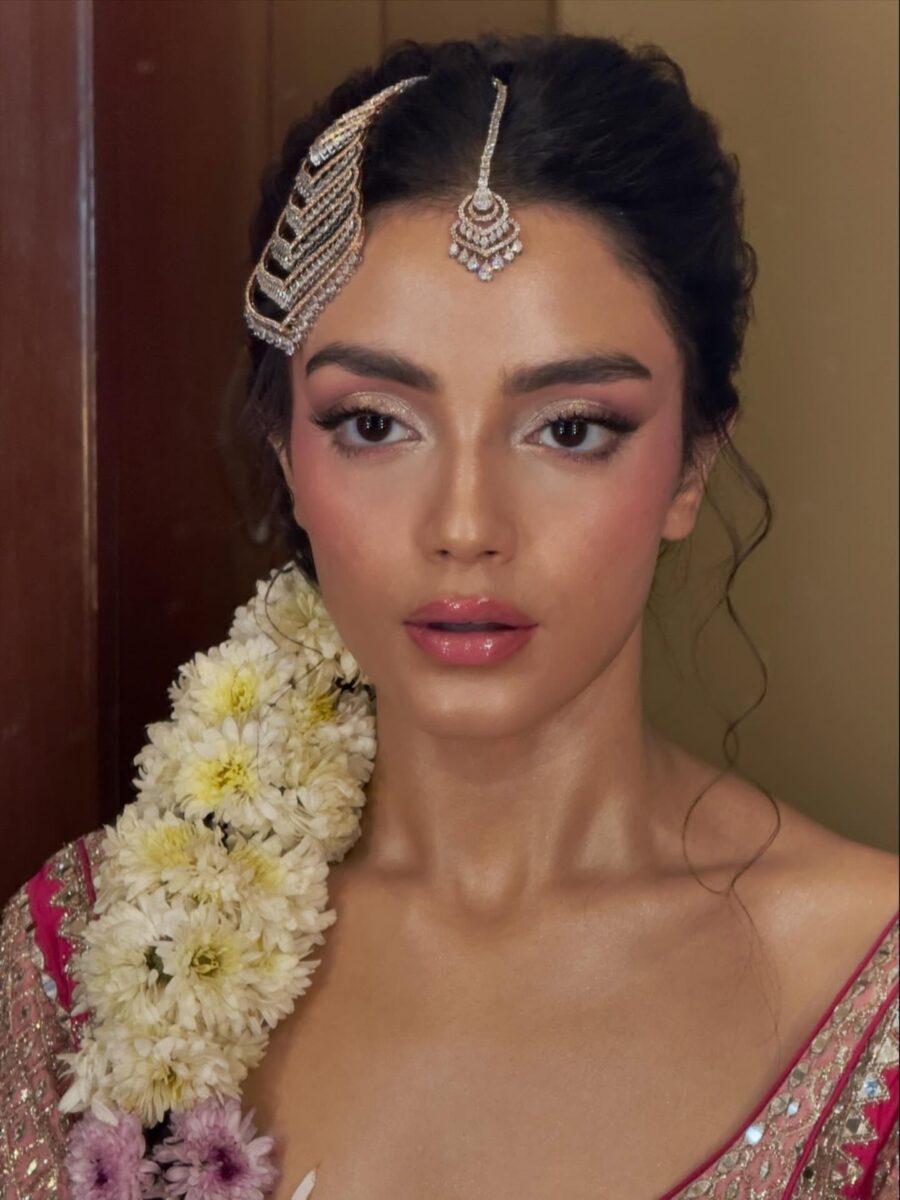 Elegant wedding guest makeup with floral accents