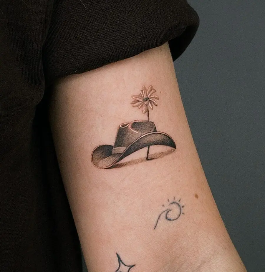 Stylish tattoo blending nature and western themes