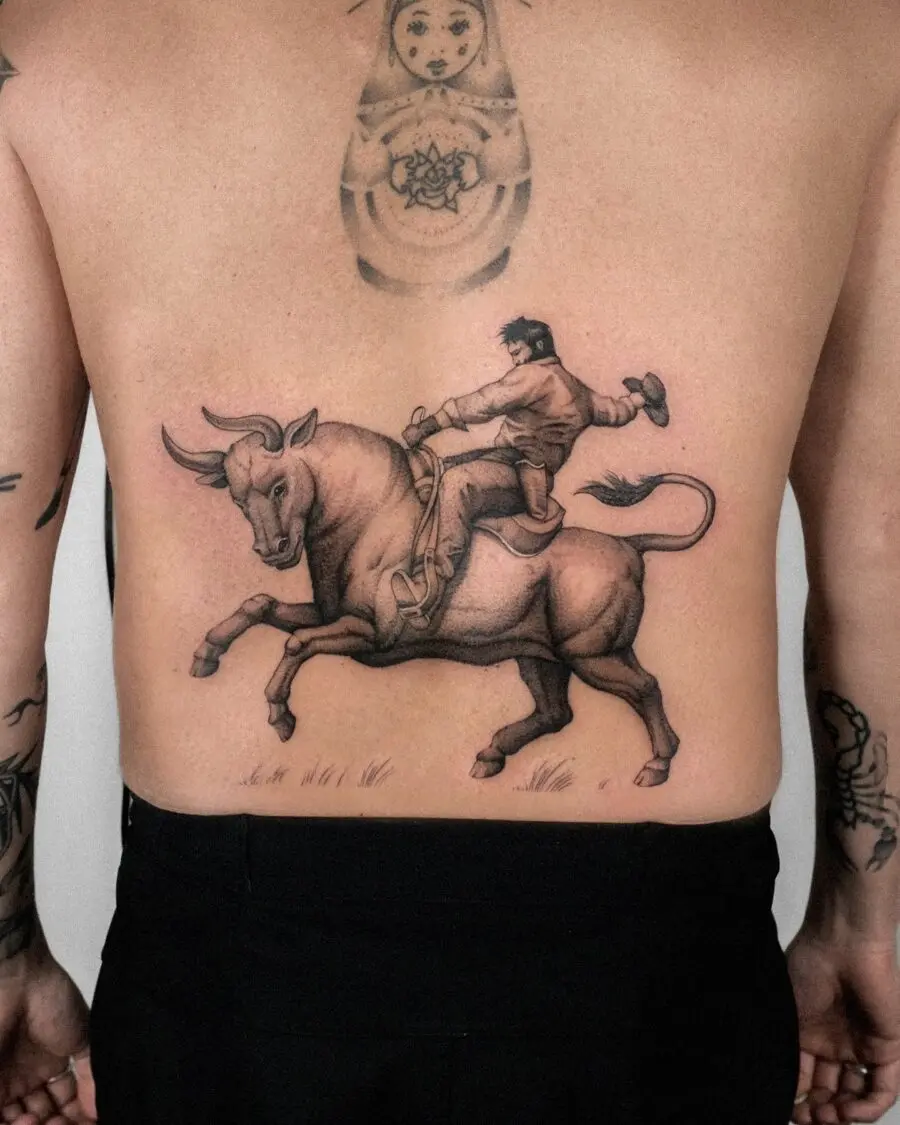 Stunning bull rider tattoo with dynamic motion
