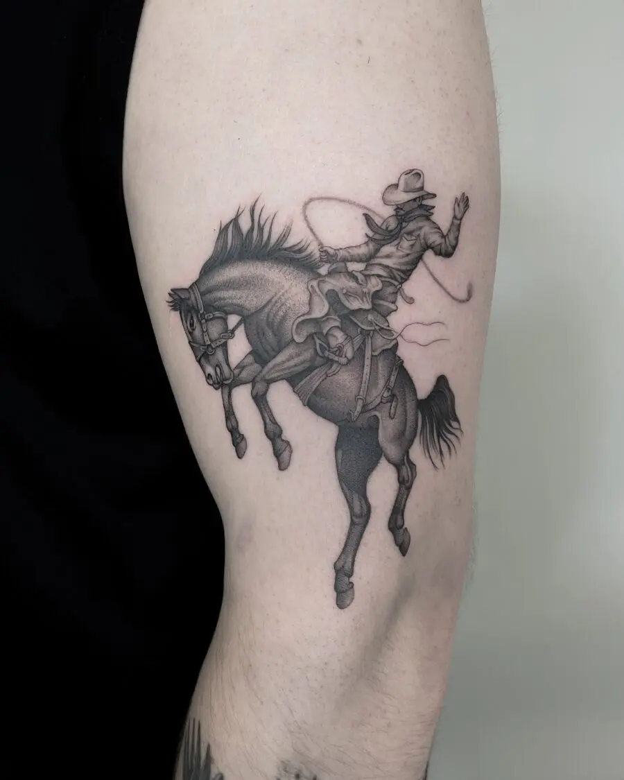 Detailed cowboy tattoo on muscular arm