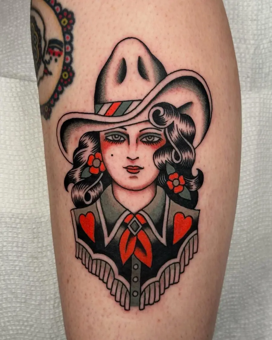 Charming Cowgirl Tattoo with Floral Accents