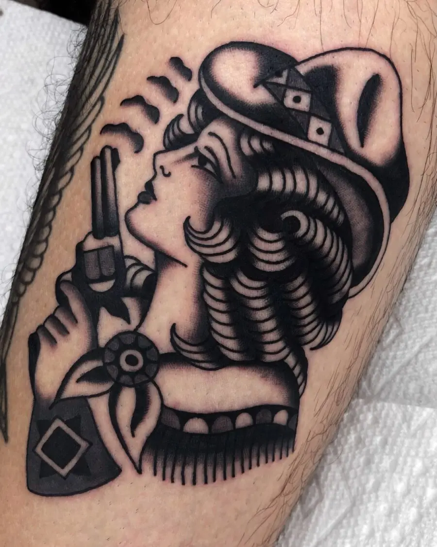 Classic cowgirl tattoo with a rebellious vibe