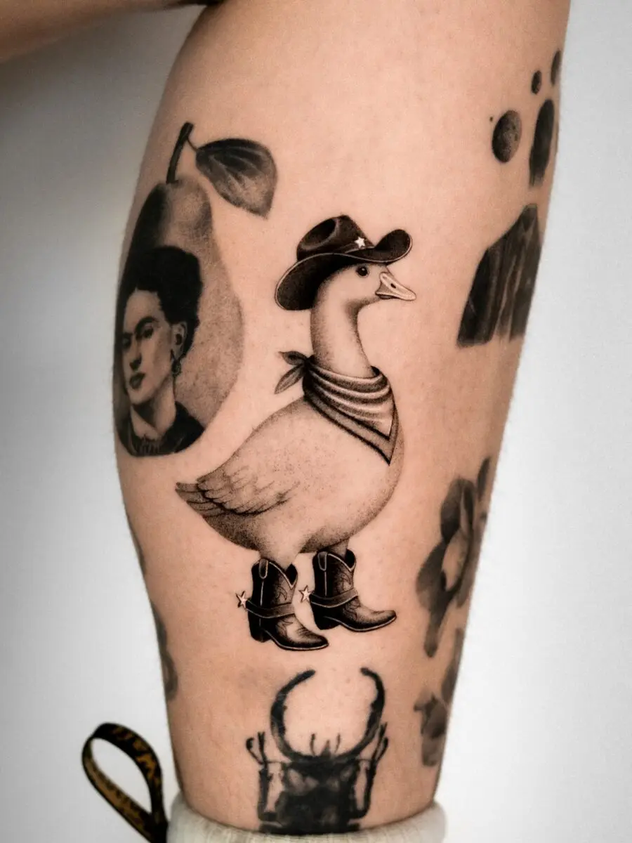Quirky cowboy duck tattoo with personality