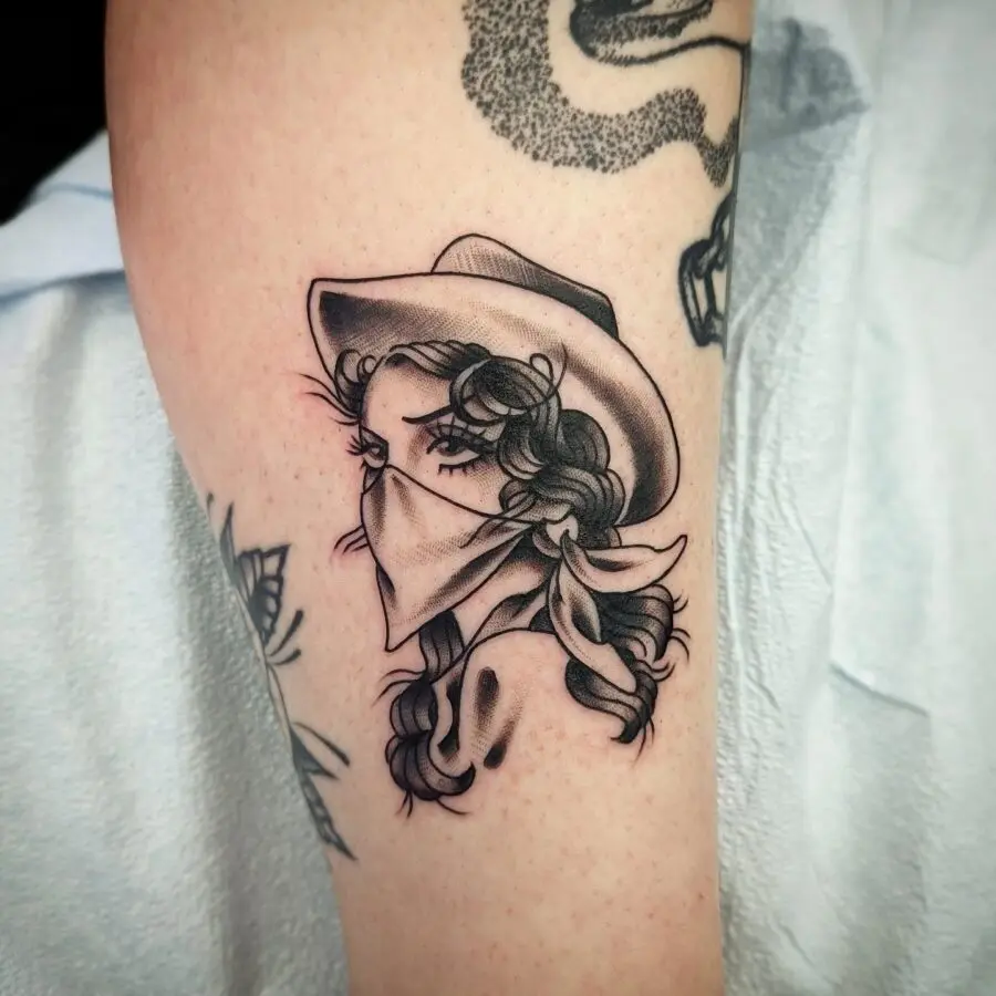 Elegant western-inspired female tattoo art