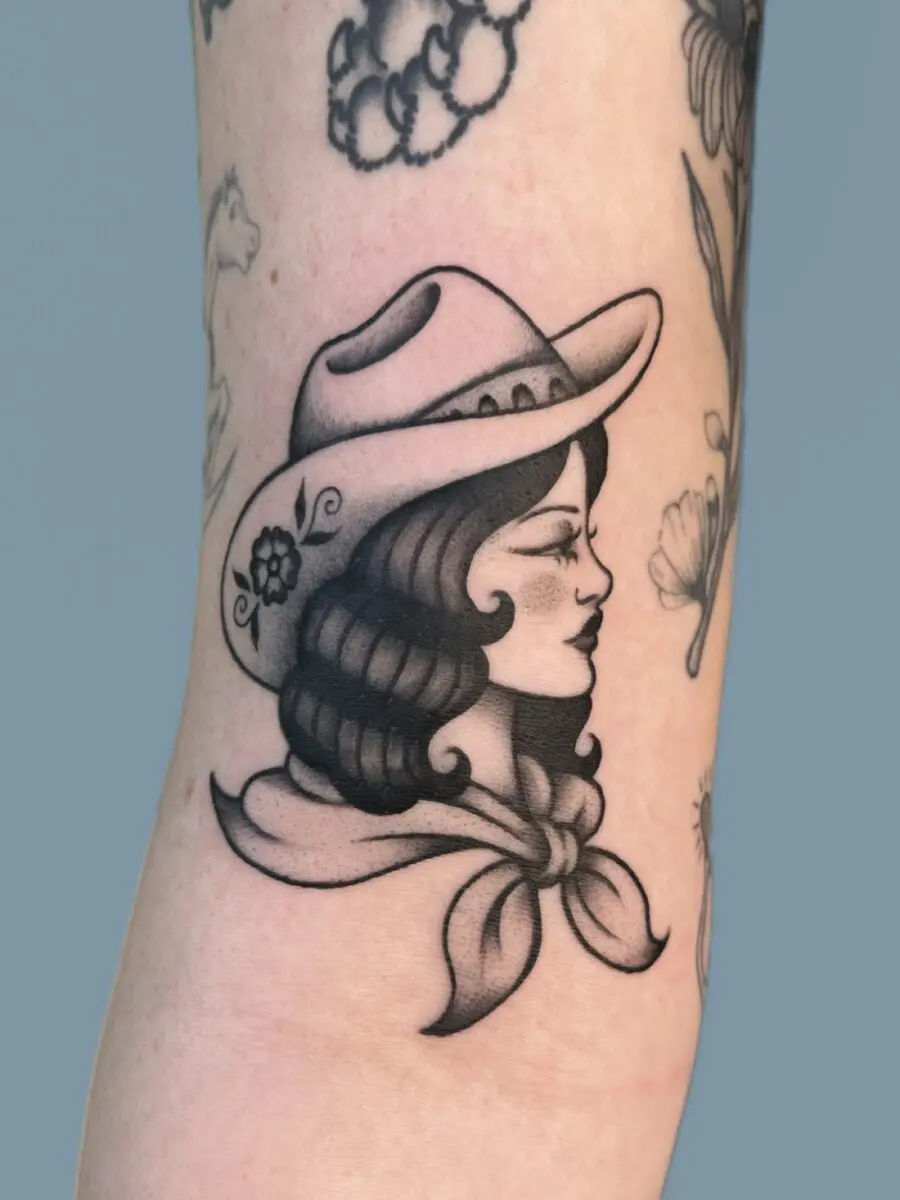 Stylish Cowgirl Tattoo with Vintage Vibes