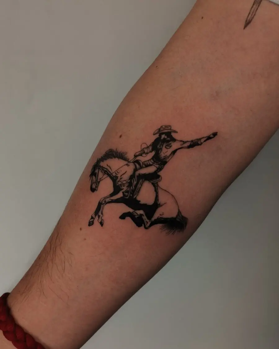 Dynamic cowboy tattoo on horseback