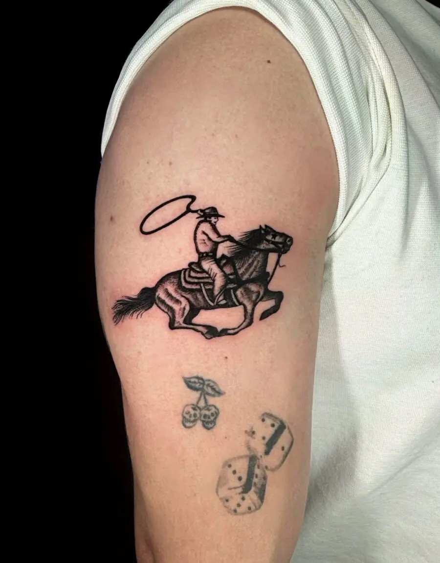 Dynamic western tattoo of cowboy on horseback