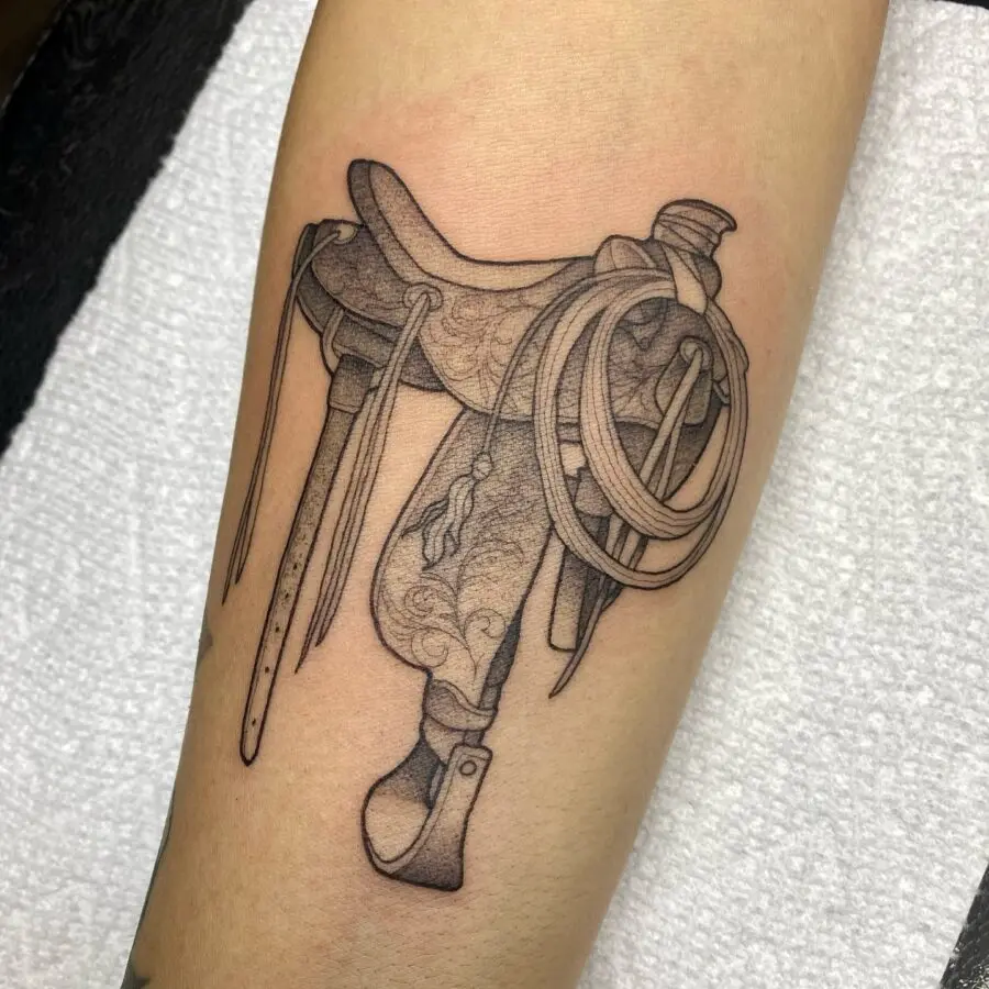 Intricate saddle tattoo reflecting western culture