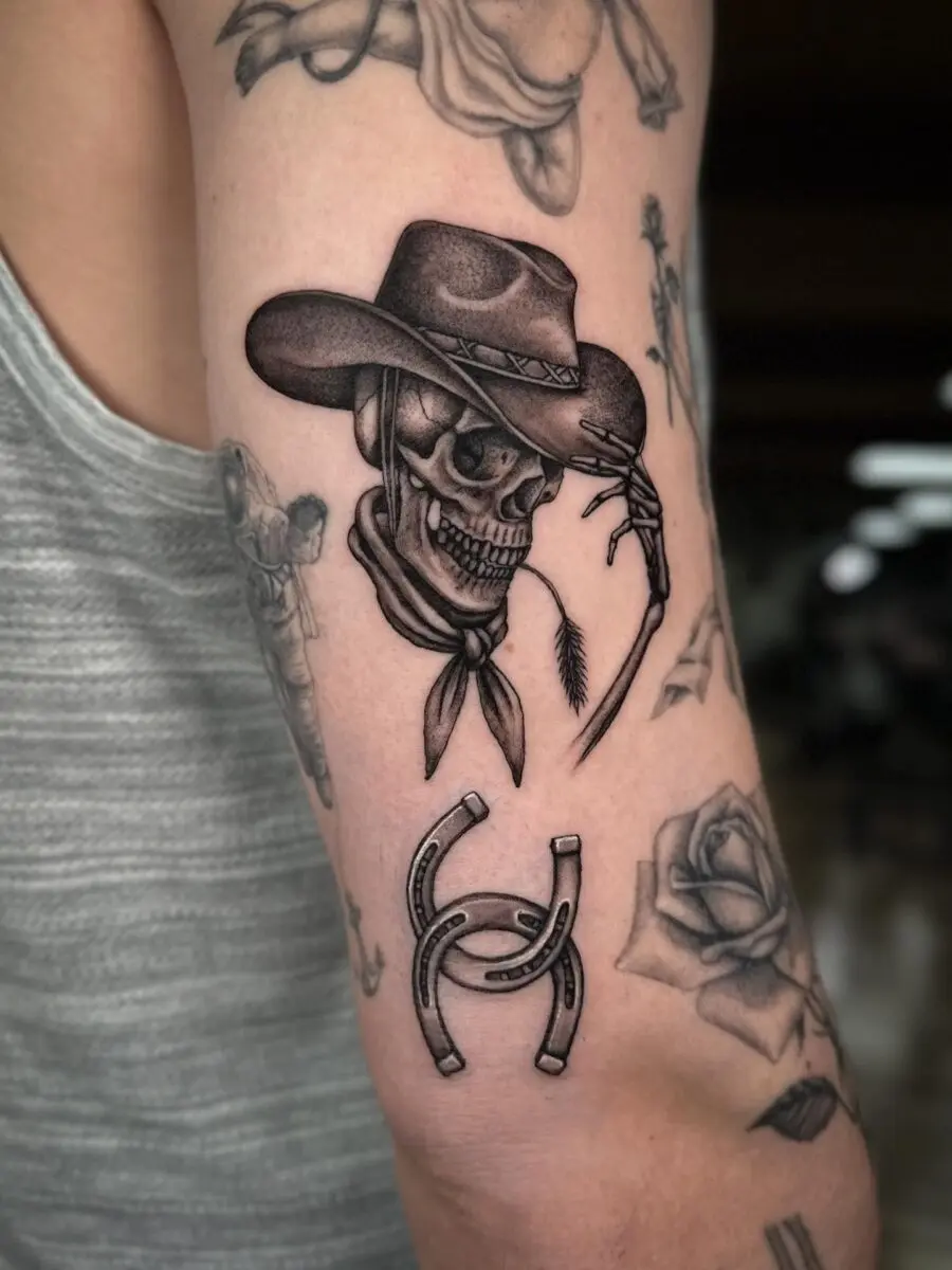 Cowboy Skull Tattoo with Horseshoe Emphasis