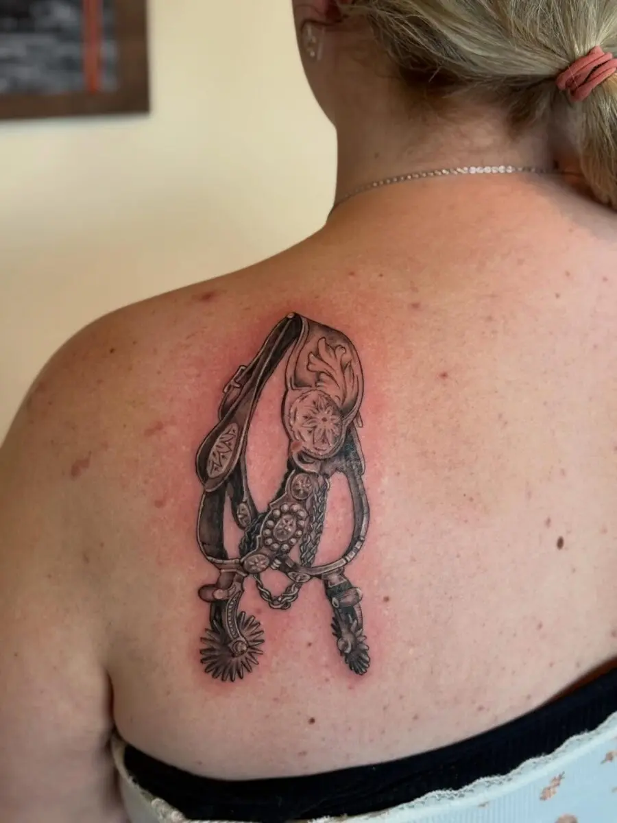 Elegant spurs tattoo showcasing western heritage