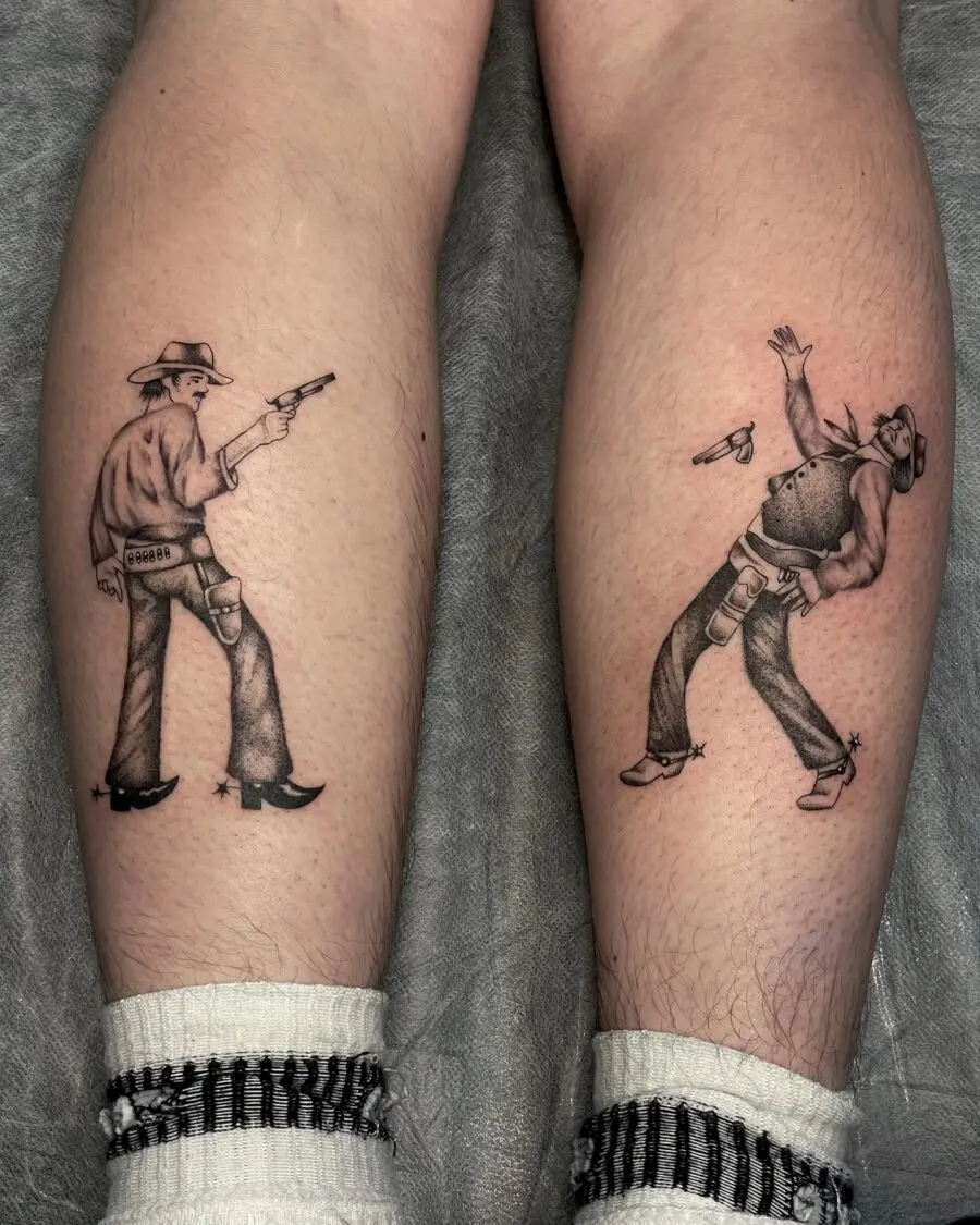 Dynamic cowboy duel tattoo with vintage flair