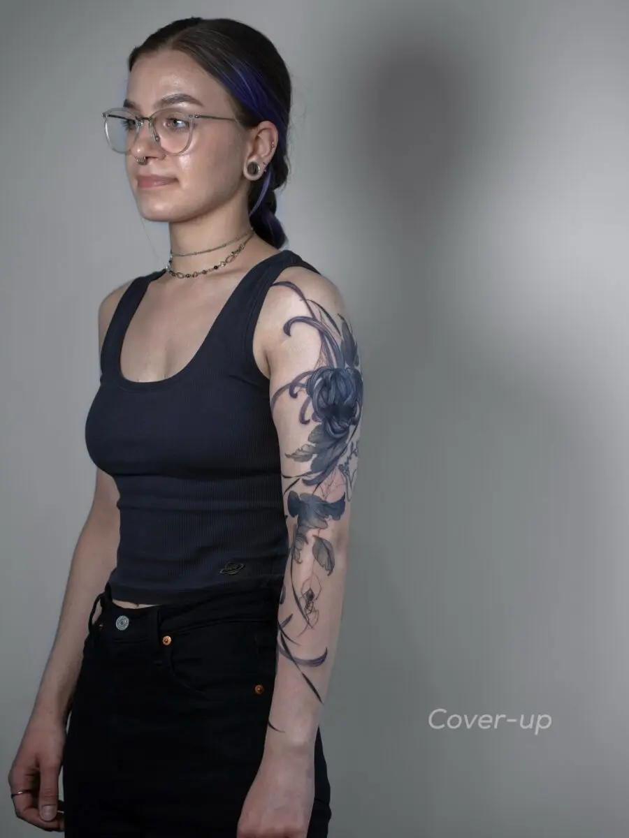 Elegant floral cover-up tattoo design showcased