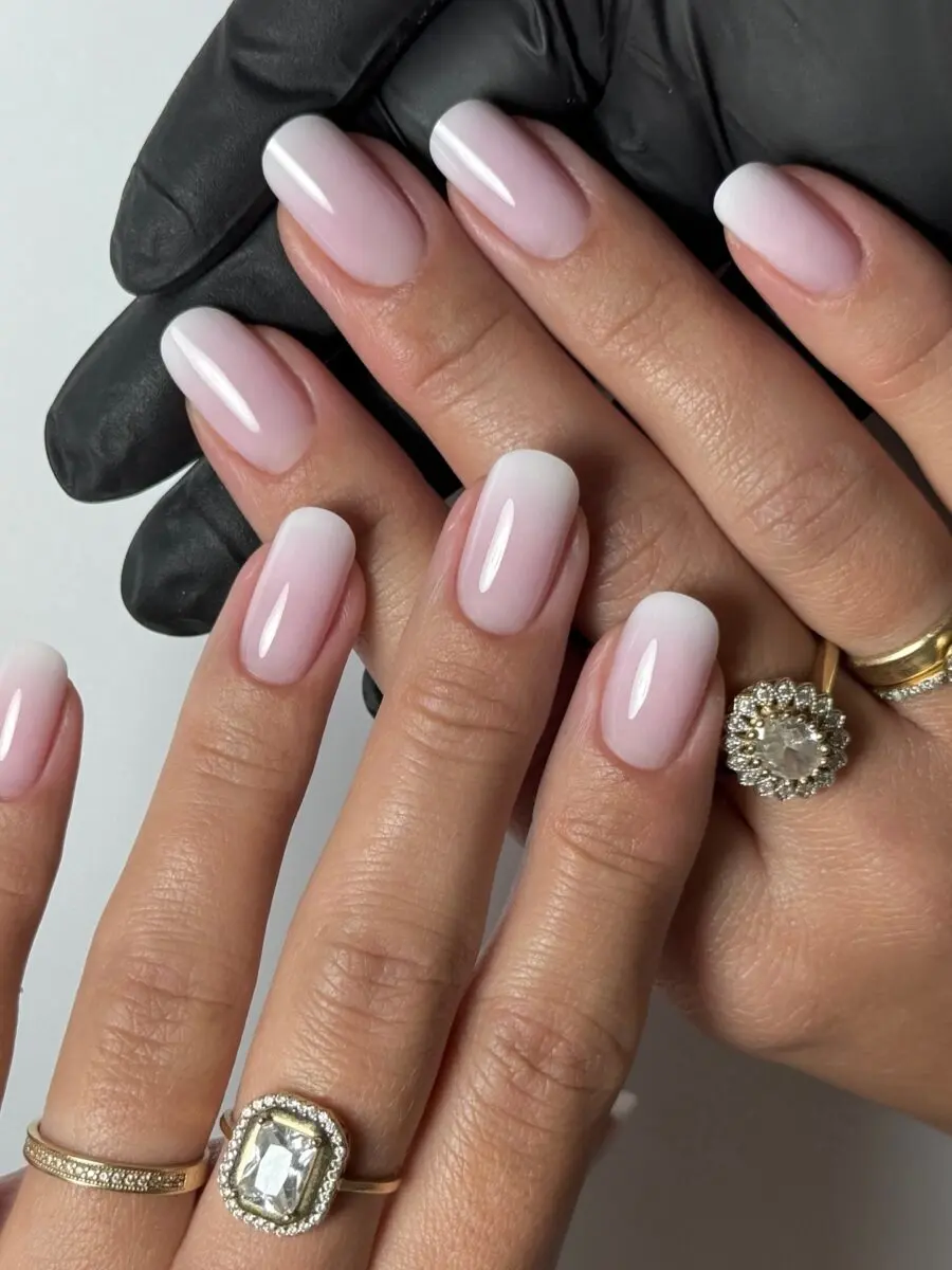 Elegant baby boomer nails with fabulous rings