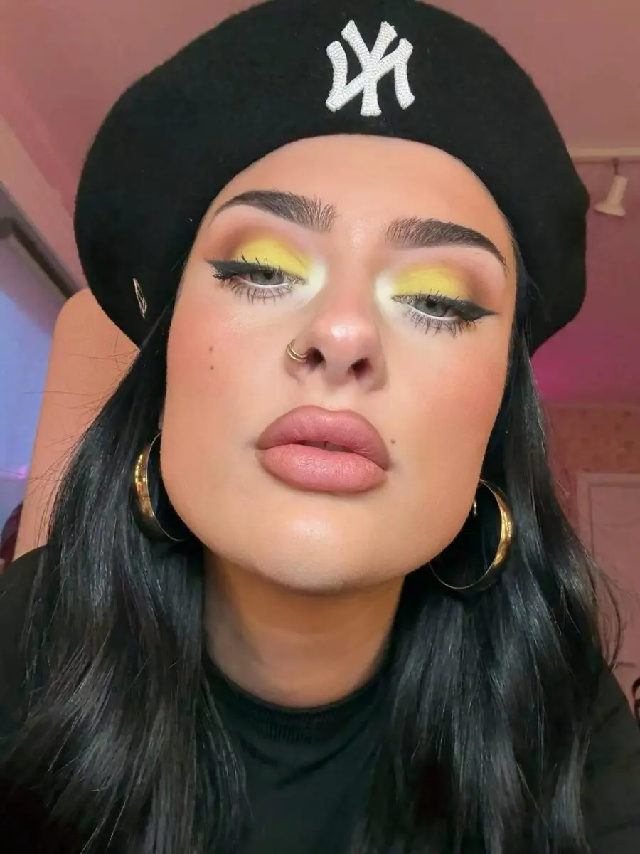 Vibrant yellow eyeshadow with bold lip look