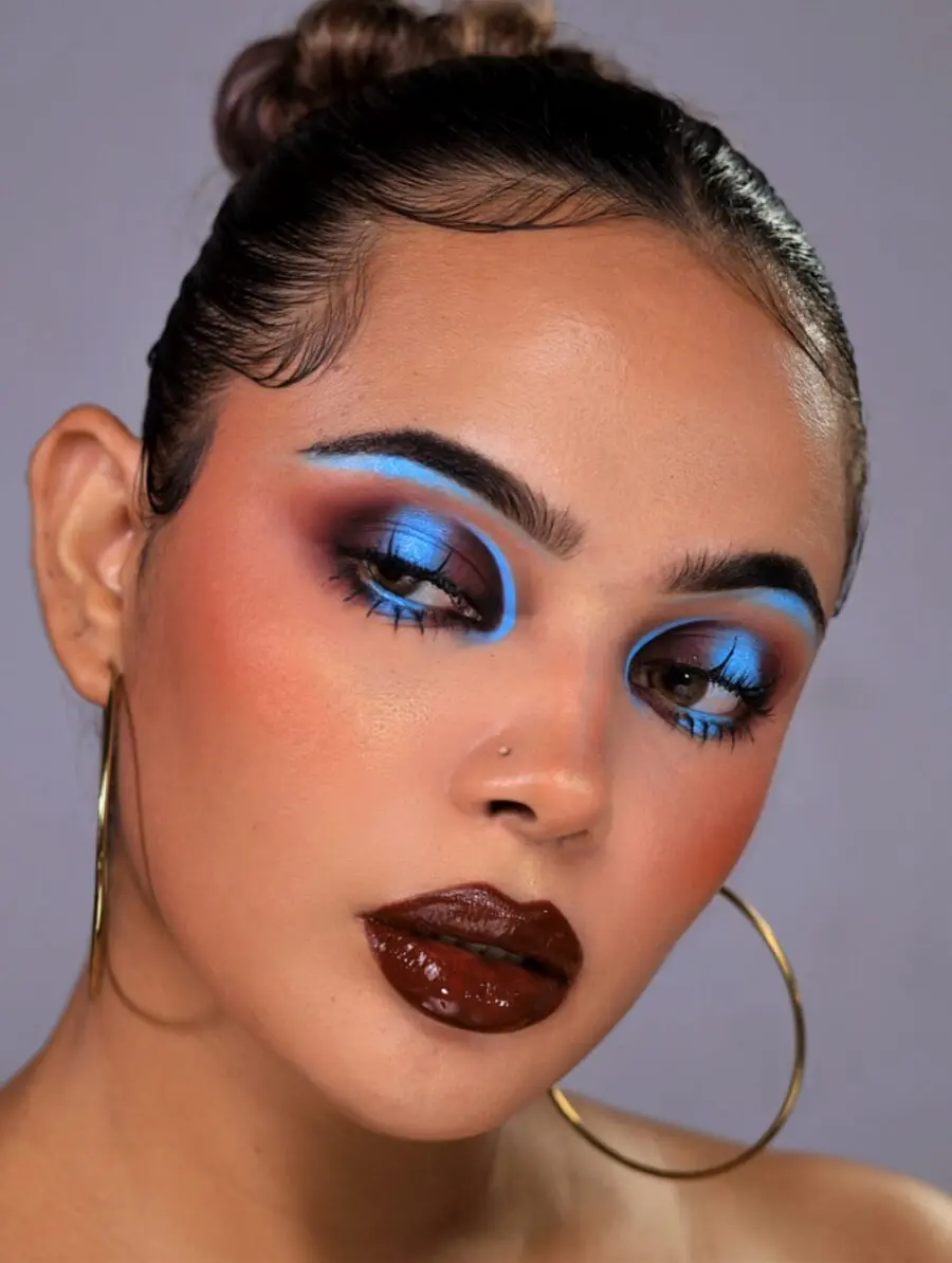 Bold blue and brown baddie makeup style