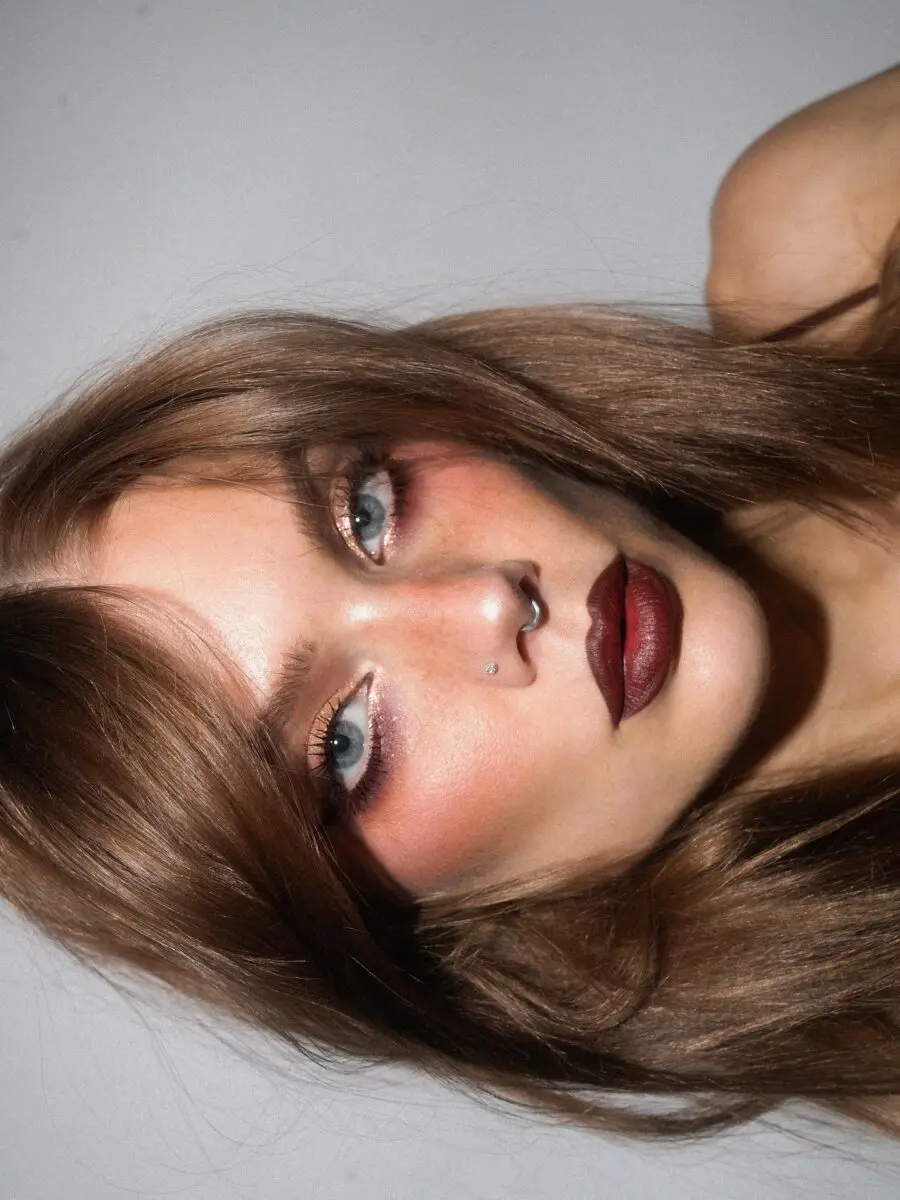 Dramatic baddie makeup with bold lip color