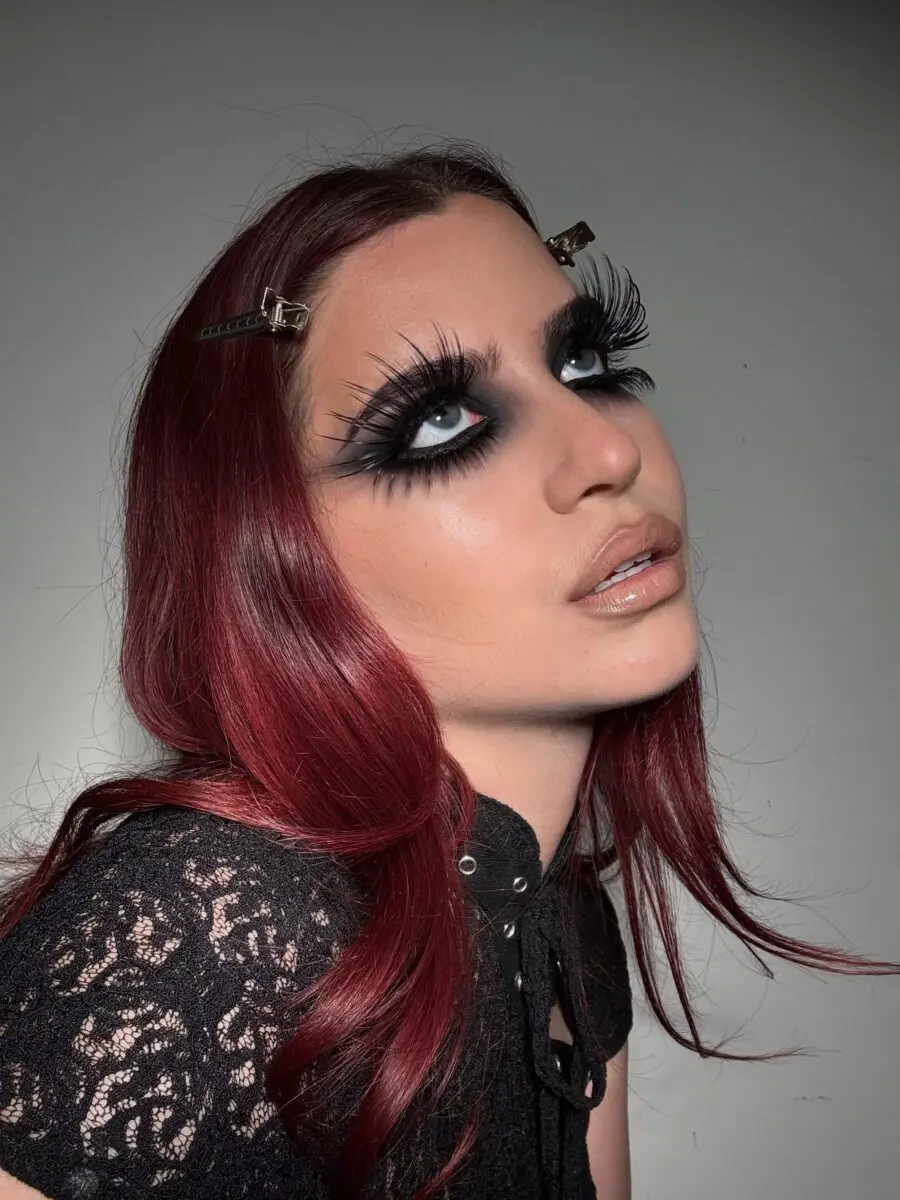 Bold eyelash statement with striking red hair