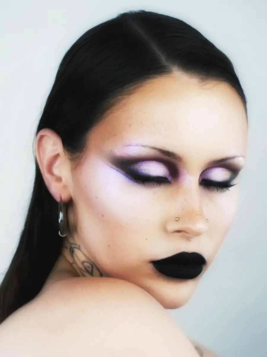Bold black lips and shimmering purple eyeshadow