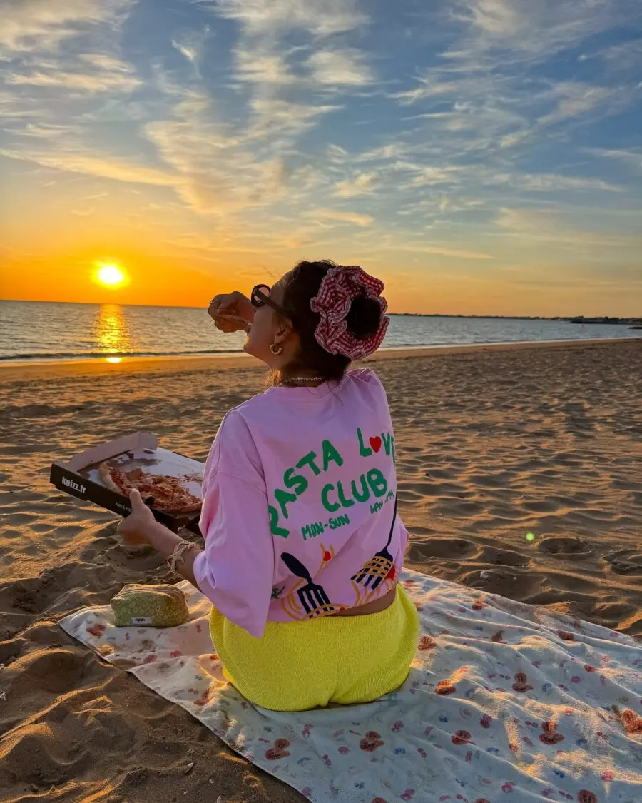 Chic beach outfit with vibrant sunset vibes