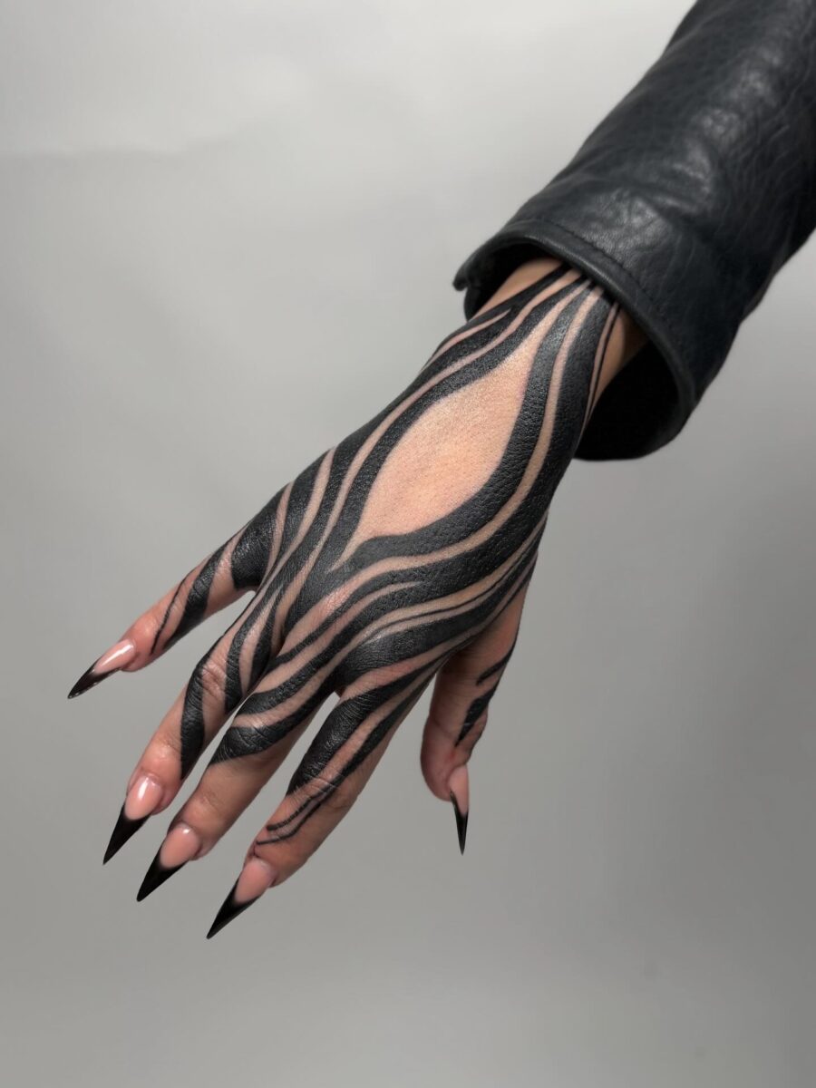 Striking Black Lines on Feminine Hand