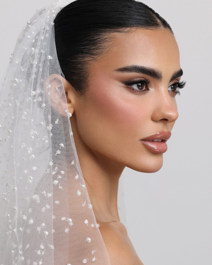 Radiant bridal makeup with a classic veil