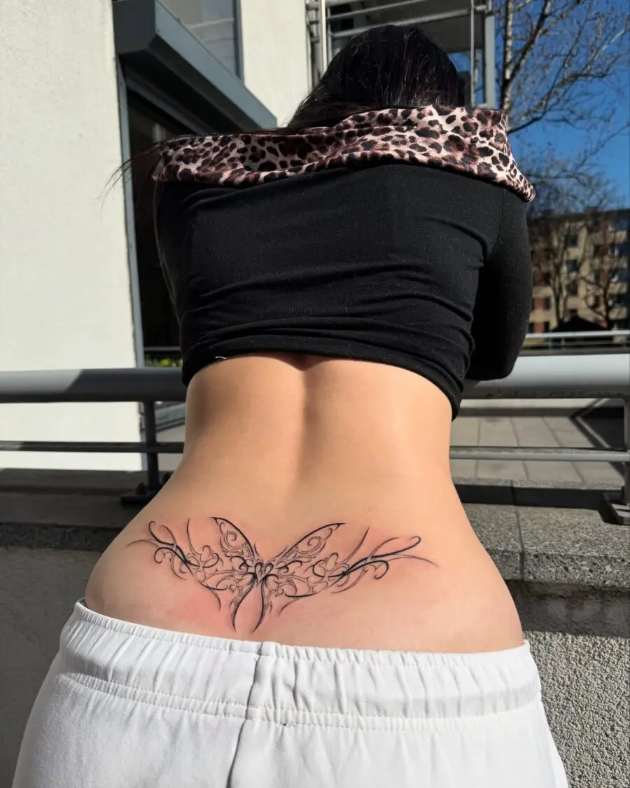 Elegant butterfly tramp stamp tattoo design