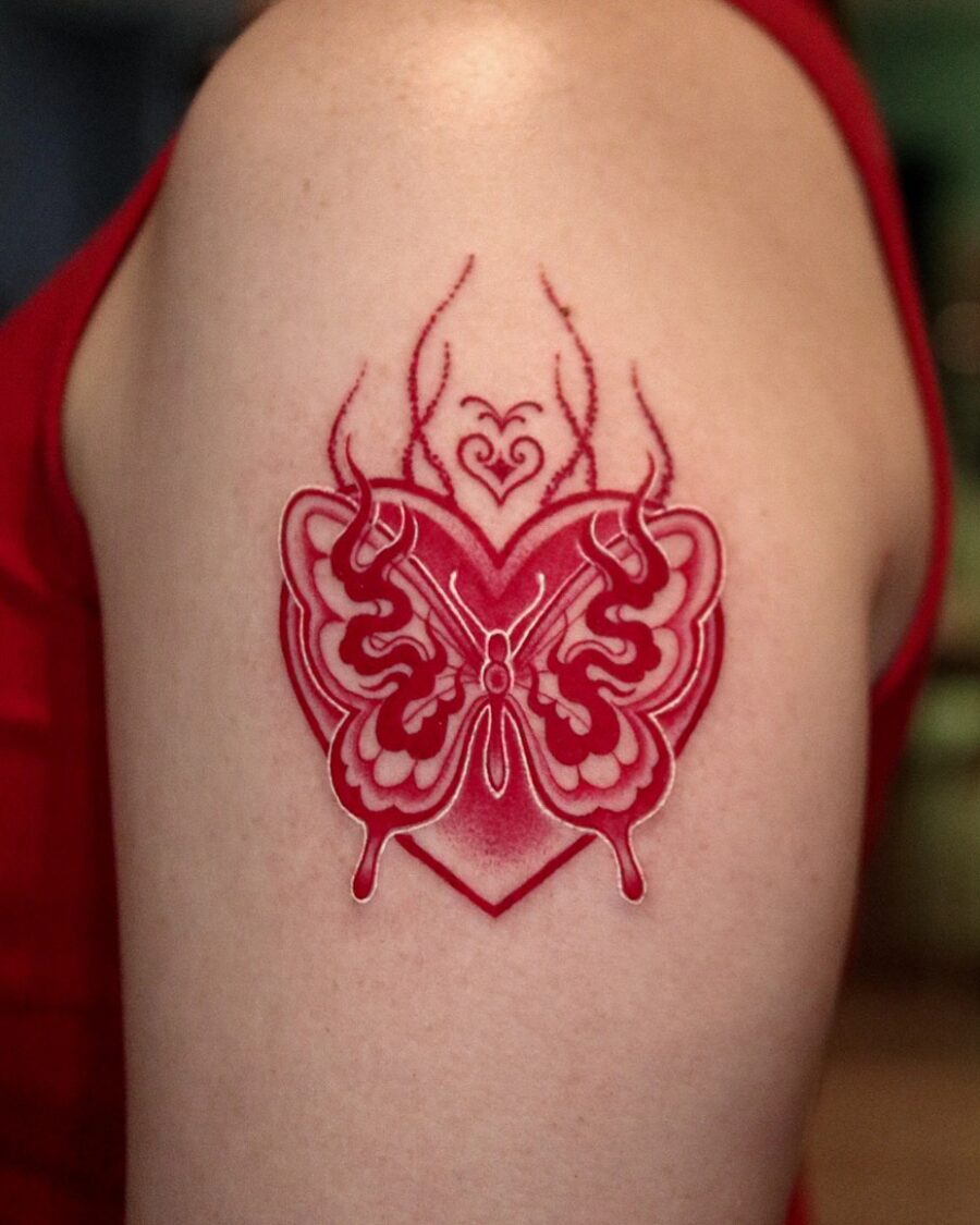 Striking red ink butterfly tattoo design