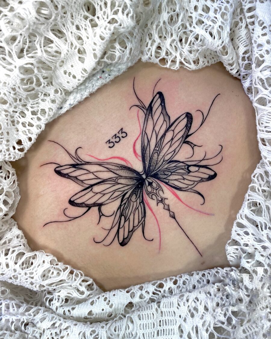 Elegant butterfly tattoo with mystical numbers