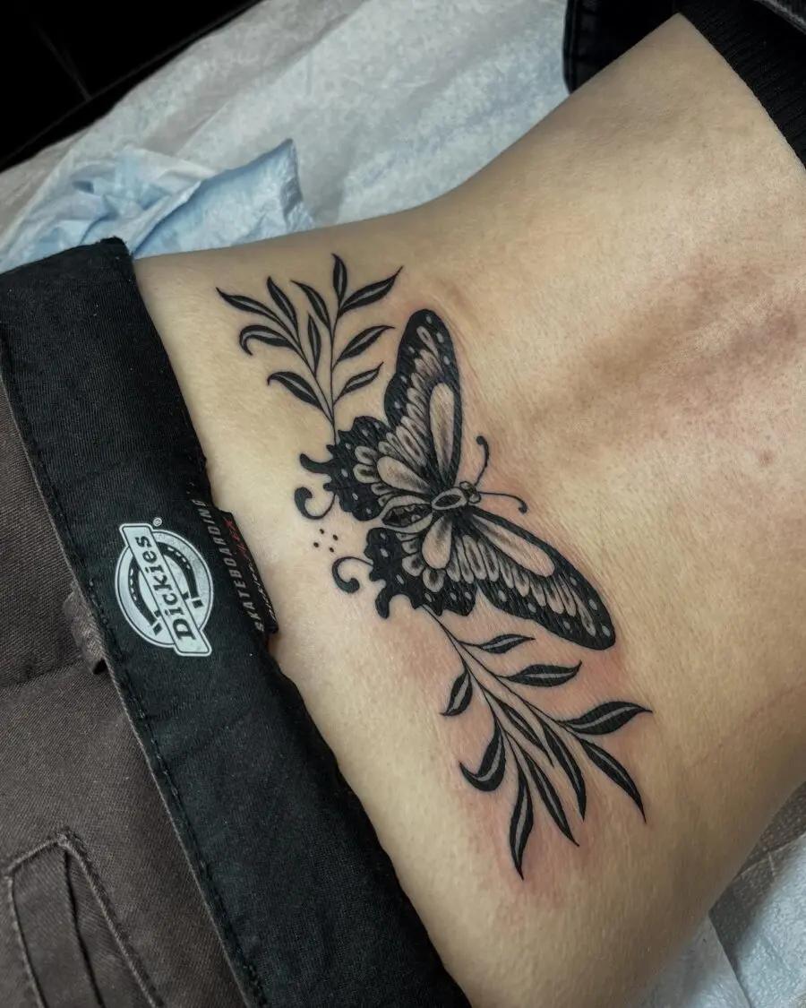 Elegant butterfly tramp stamp with floral accents