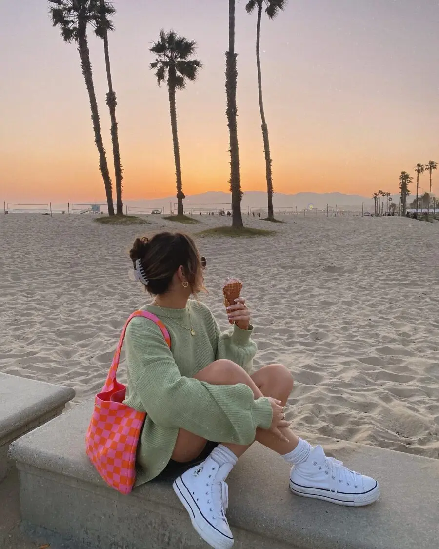 Chic beach outfit with ice cream and sunset