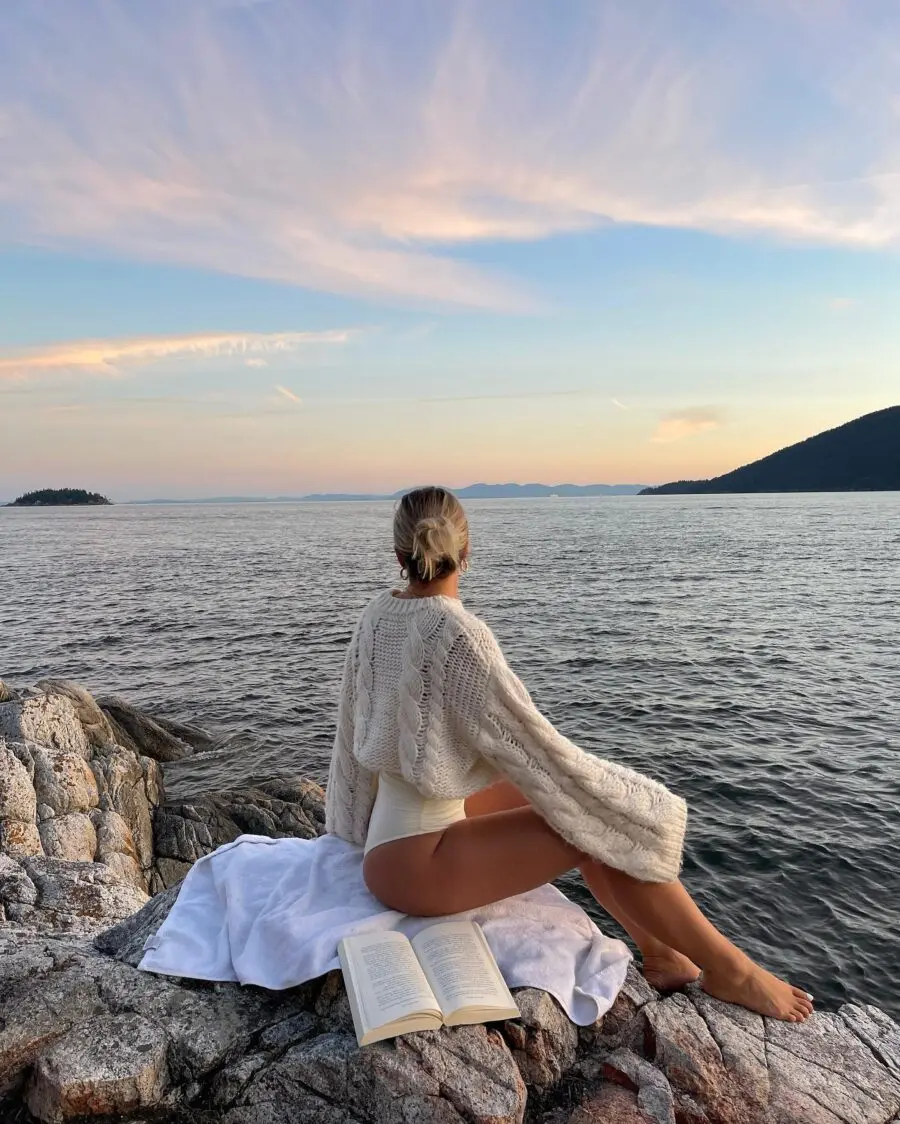 Chic knitwear meets swimwear by the shore