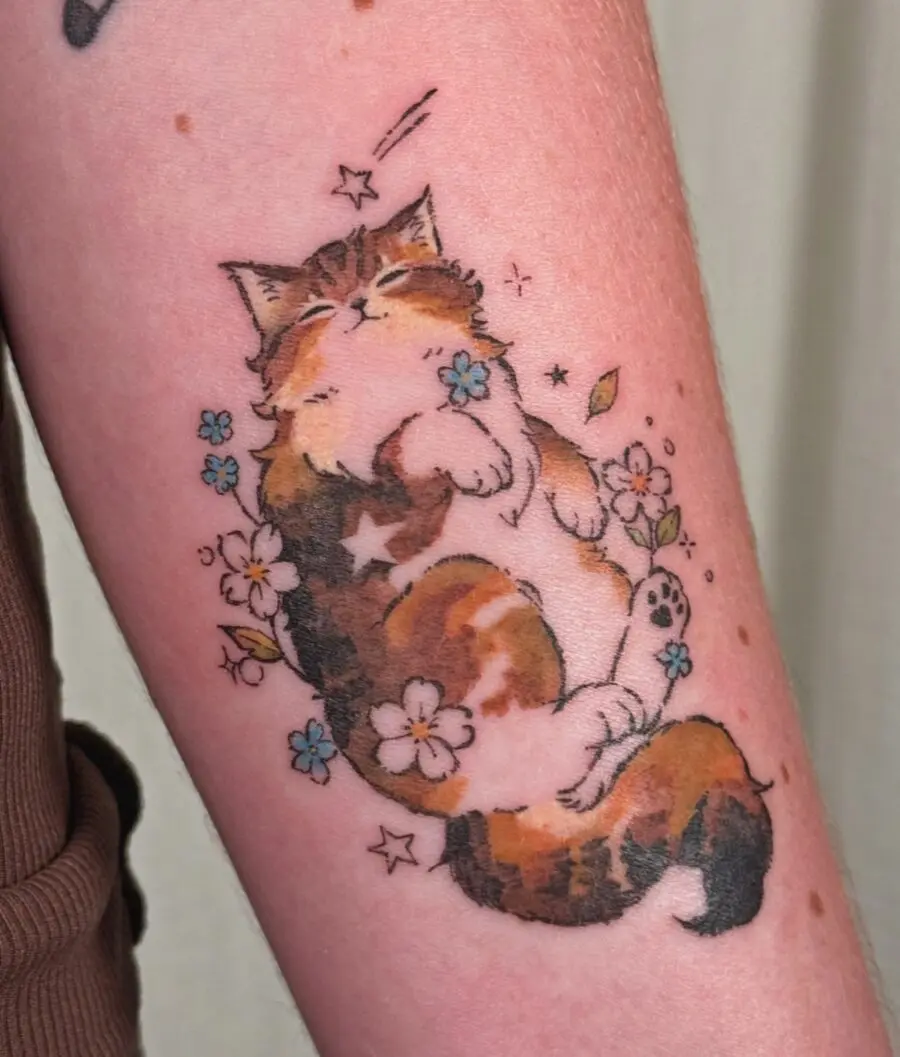 Whimsical cat tattoo with floral accents
