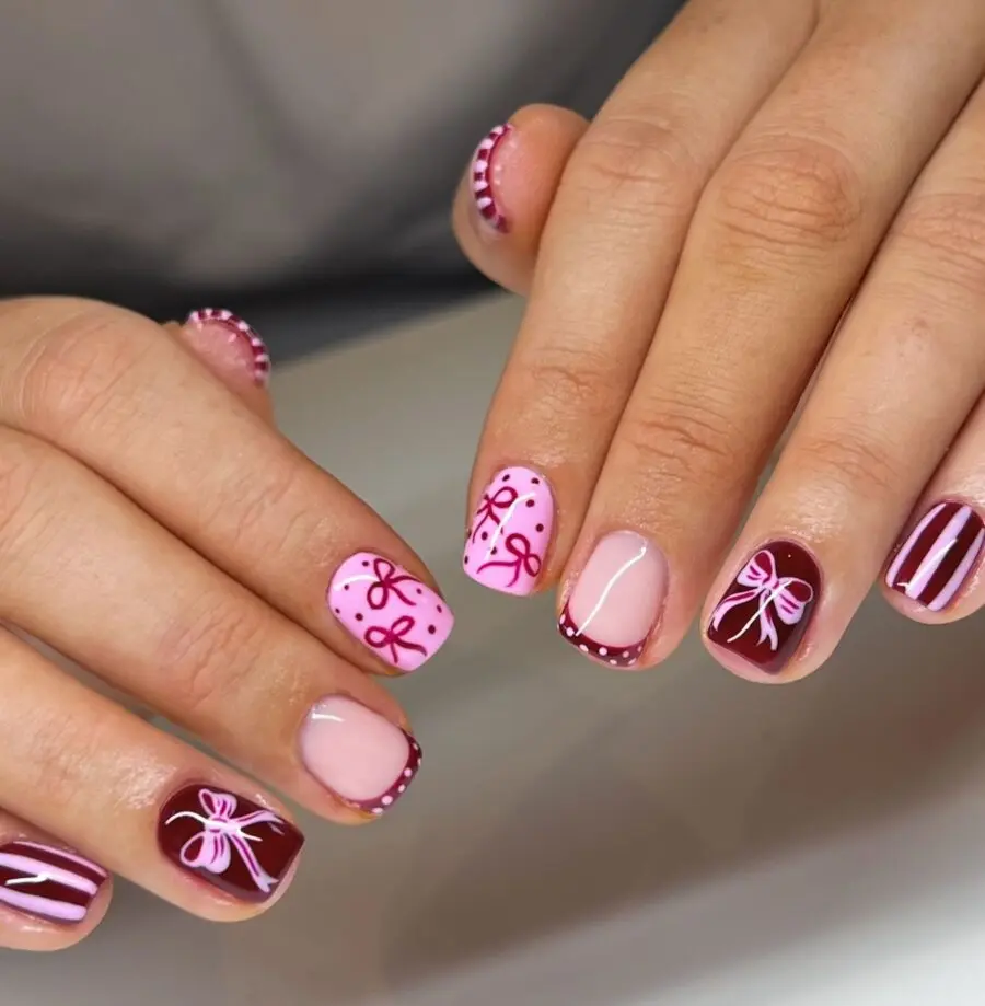 Festive pink and red Christmas nail design
