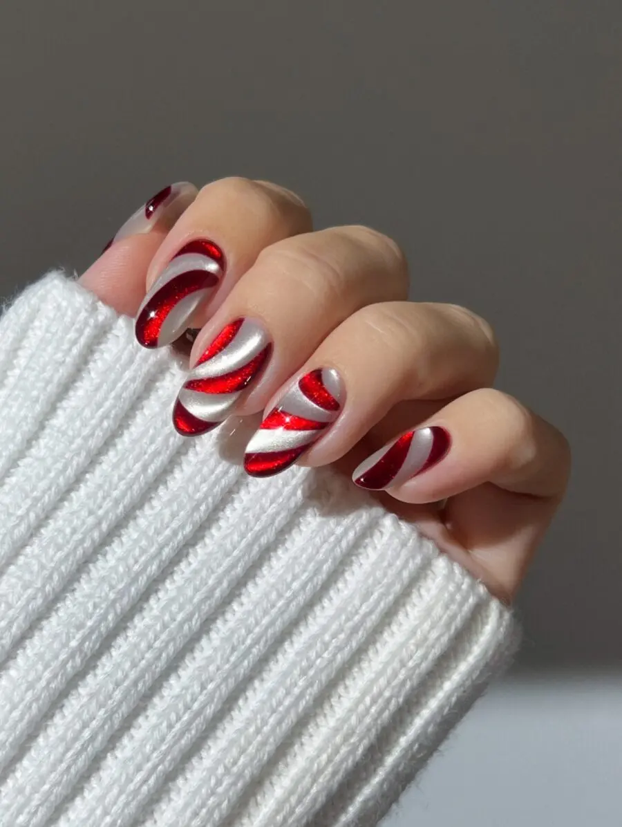 Festive candy cane-inspired Christmas nail design