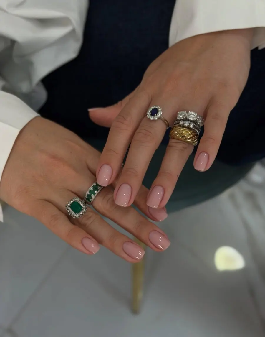 Elegant nails adorned with stunning rings.