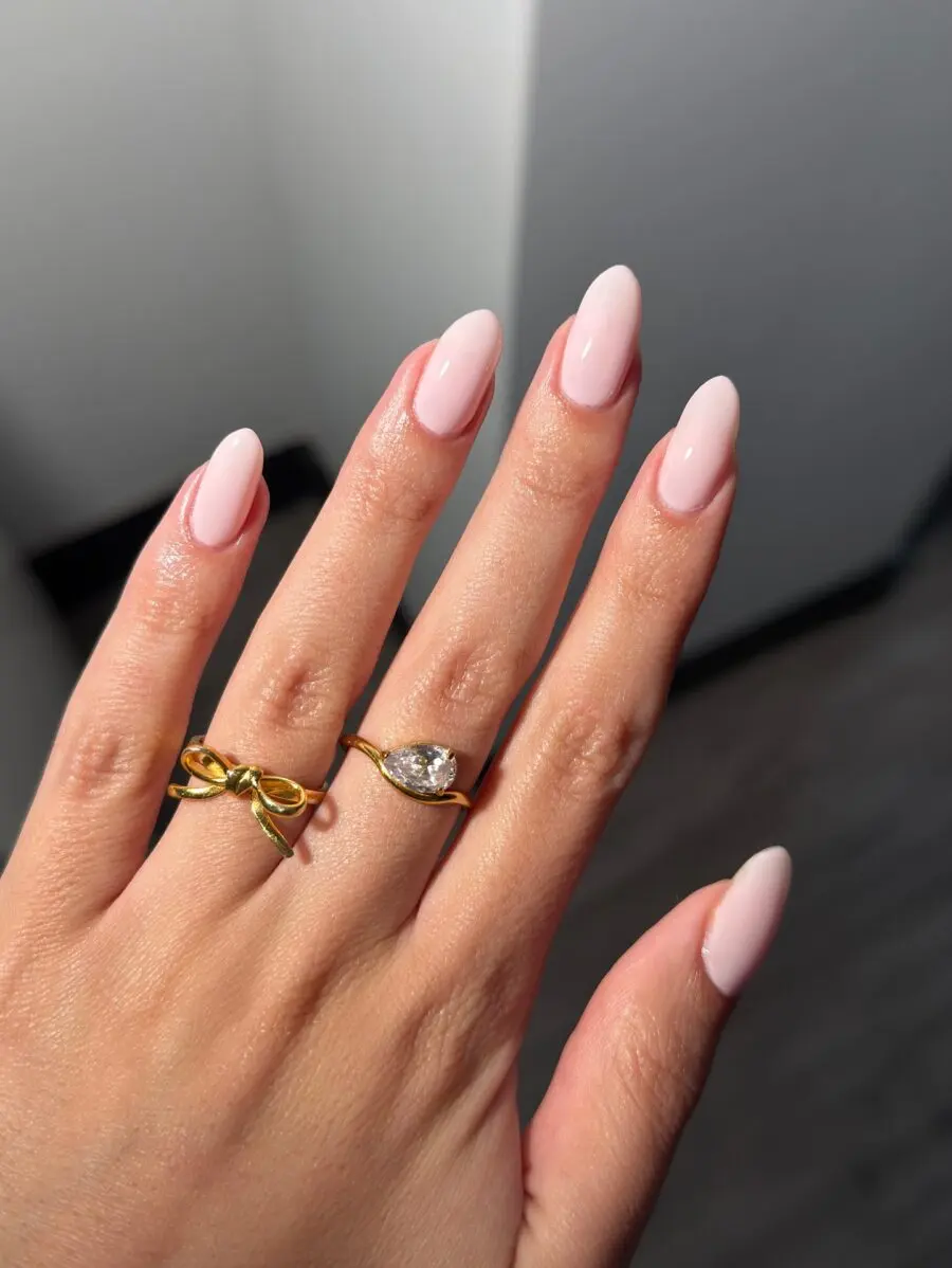 Elegant pink nails with chic rings