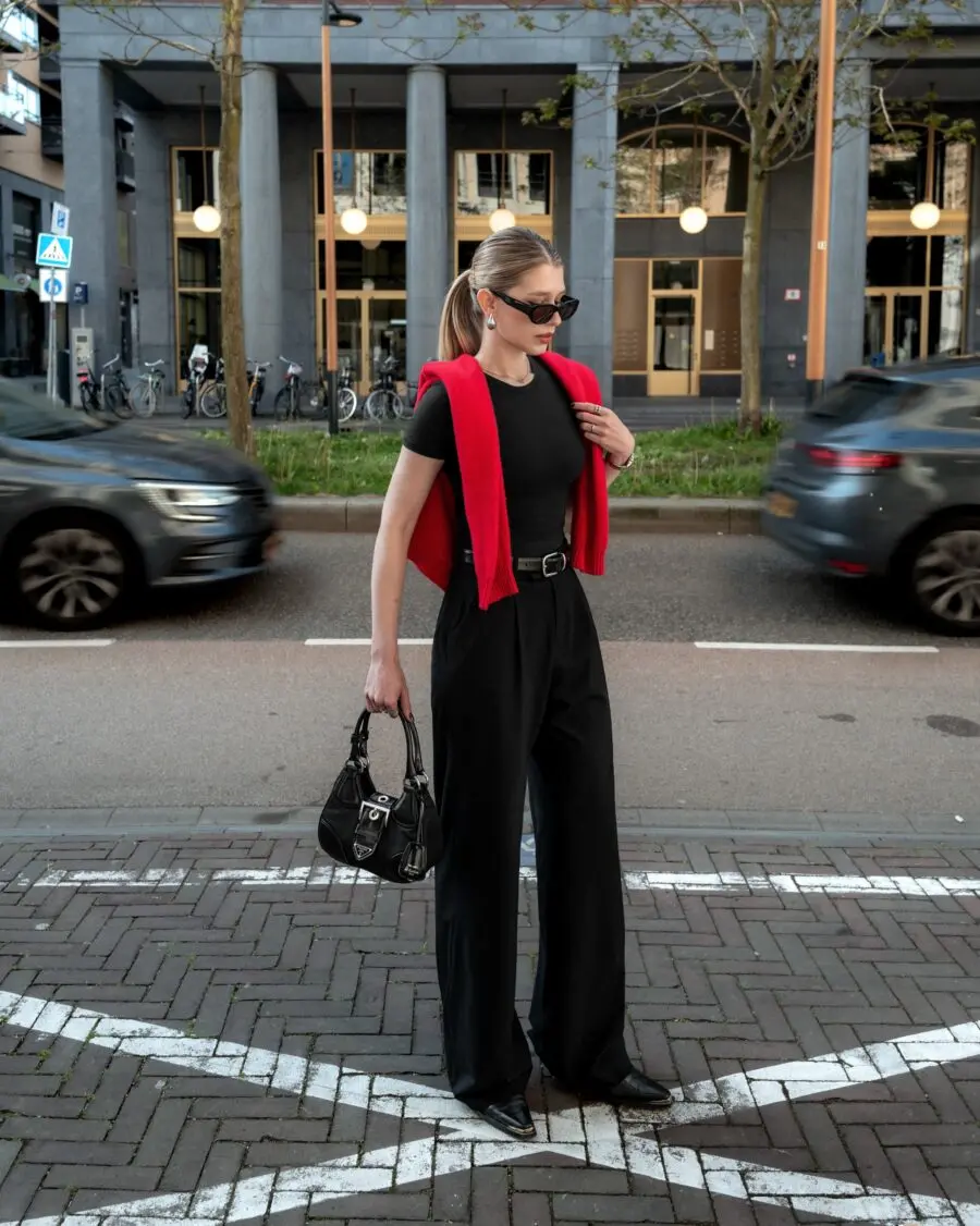 Chic monochrome look with red accents